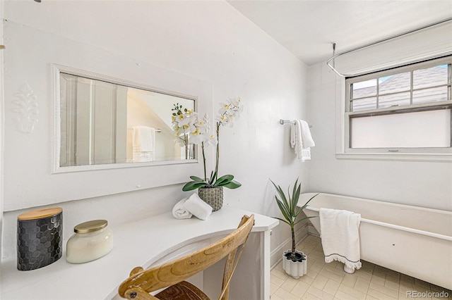 bathroom featuring baseboards and tile patterned floors