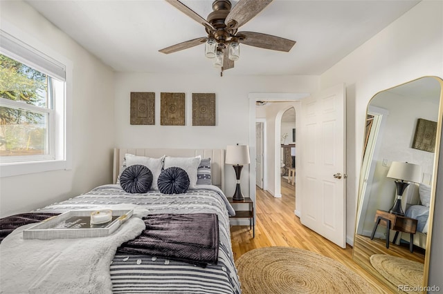 bedroom featuring ceiling fan and light hardwood / wood-style floors