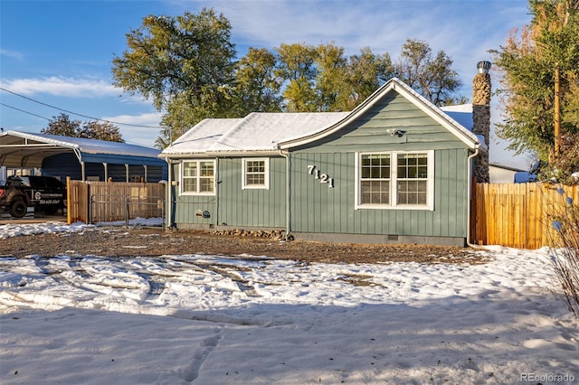 view of front of home with a carport