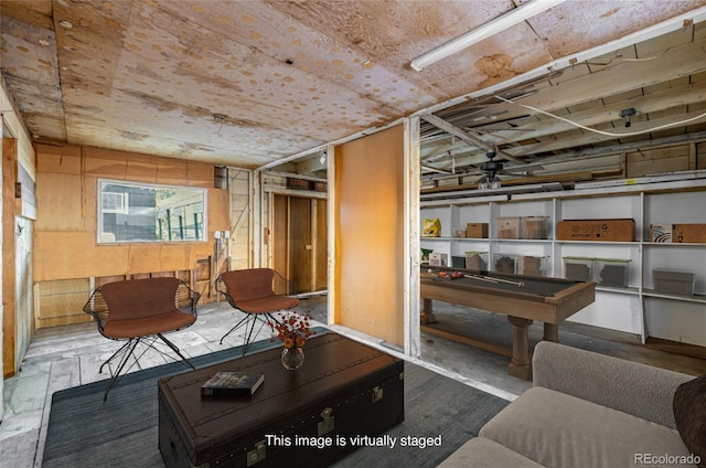 living room featuring ceiling fan and pool table