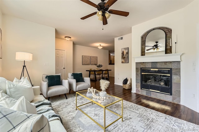 4221 S Blackhawk Cir Unit 7G, Aurora, CO 80014 - living area with a ceiling fan, a tile fireplace, and dark wood-style floors