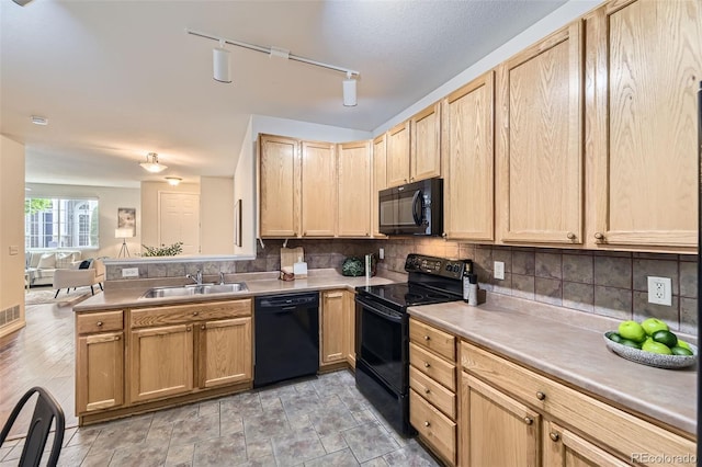 4221 S Blackhawk Cir Unit 7G, Aurora, CO 80014 - kitchen with black appliances, light brown cabinets, open floor plan, and decorative backsplash