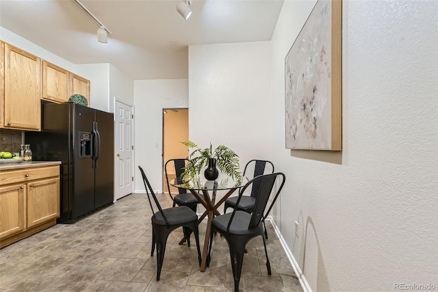 4221 S Blackhawk Cir Unit 7G, Aurora, CO 80014 - dining room featuring track lighting and baseboards