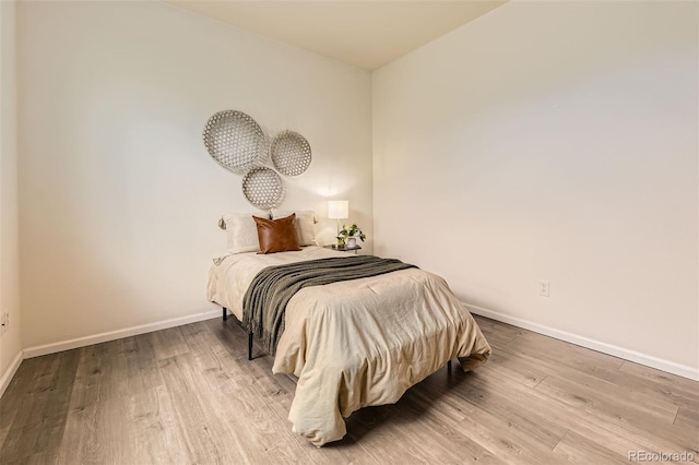 4221 S Blackhawk Cir Unit 7G, Aurora, CO 80014 - bedroom with wood finished floors