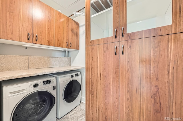 475 W 12th Ave Unit 9A, Denver, CO 80204 - washroom with washing machine and clothes dryer, cabinet space, and light marble finish flooring