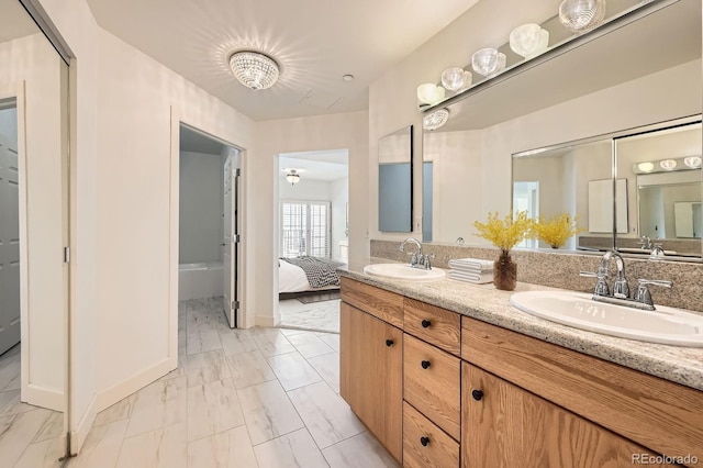 475 W 12th Ave Unit 9A, Denver, CO 80204 - bathroom featuring marble finish flooring, double vanity, and connected bathroom