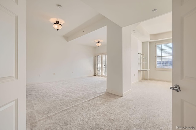 475 W 12th Ave Unit 9A, Denver, CO 80204 - carpeted empty room featuring a raised ceiling and baseboards