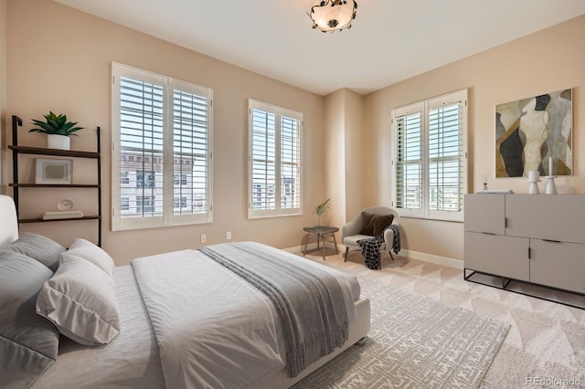 475 W 12th Ave Unit 9A, Denver, CO 80204 - carpeted bedroom with multiple windows and baseboards