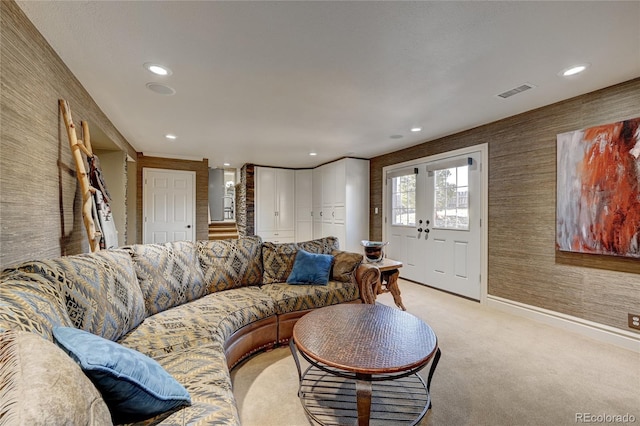 carpeted living room with french doors