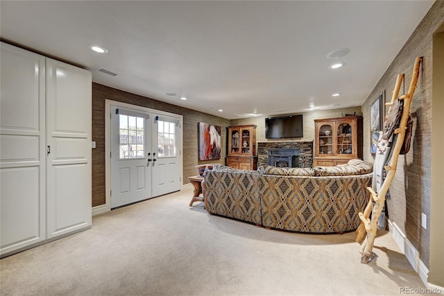 carpeted living room featuring french doors