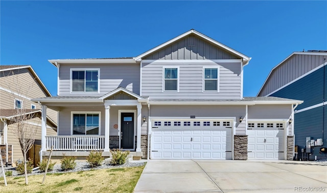 17341 Red Cosmos Pt, Parker, CO 80134 - view of front of home featuring a porch, board and batten siding, stone siding, and concrete driveway