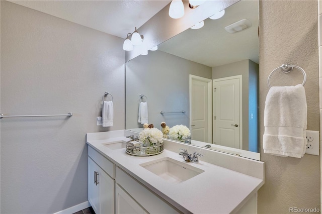17341 Red Cosmos Pt, Parker, CO 80134 - full bathroom with double vanity and a sink