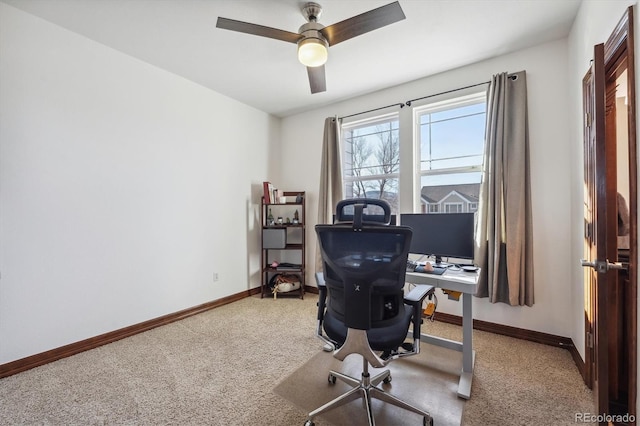 office area featuring carpet, ceiling fan, and baseboards