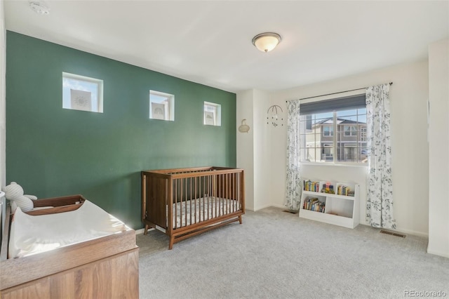 bedroom featuring light colored carpet