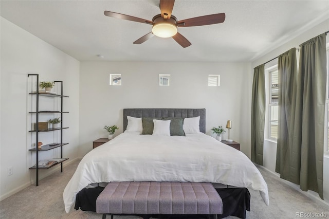 bedroom with light colored carpet and ceiling fan