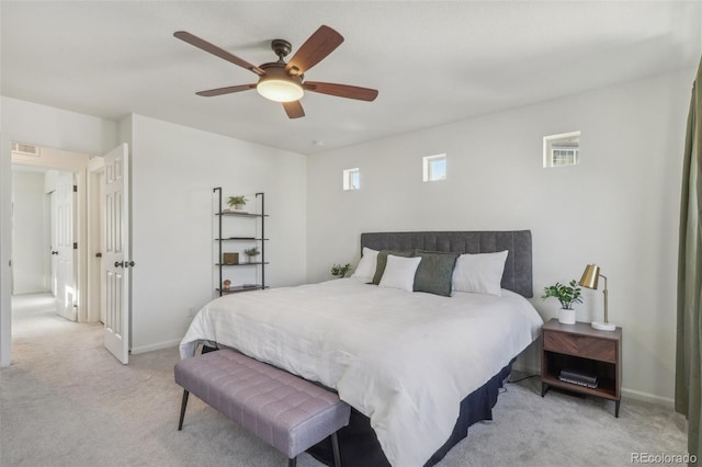 bedroom with light carpet and ceiling fan