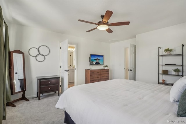 carpeted bedroom featuring connected bathroom and ceiling fan