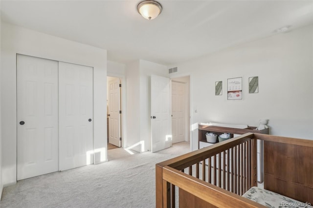 carpeted bedroom with a closet