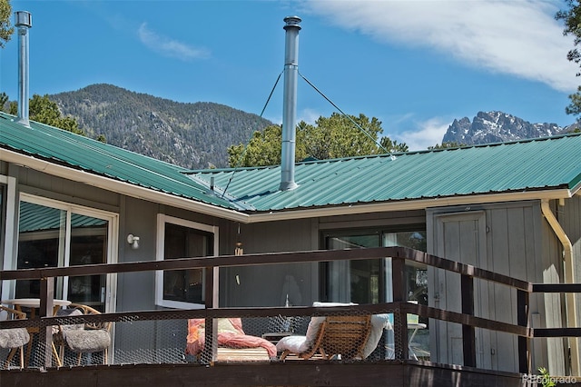 back of property with a mountain view