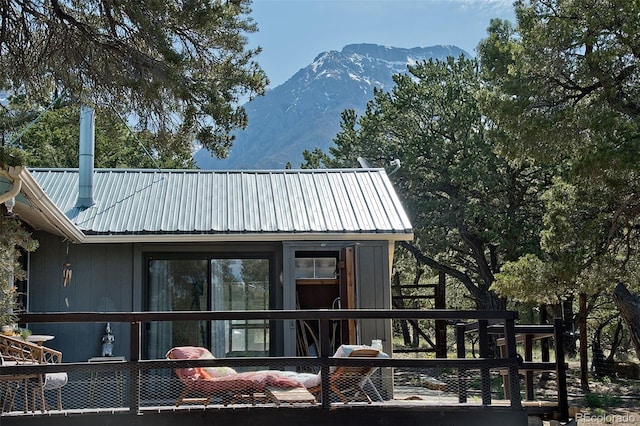 back of house with a mountain view