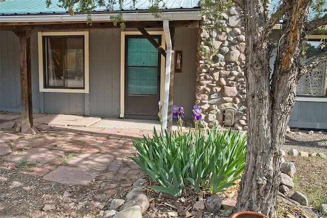 doorway to property featuring a patio