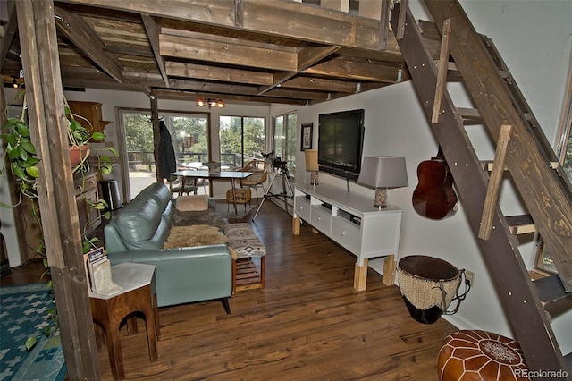 living room with dark hardwood / wood-style floors and beam ceiling