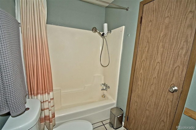 bathroom with toilet, shower / tub combo, and tile patterned flooring