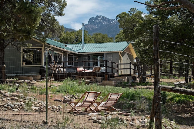 back of property with a mountain view