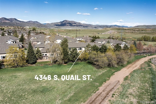 birds eye view of property with a residential view and a mountain view