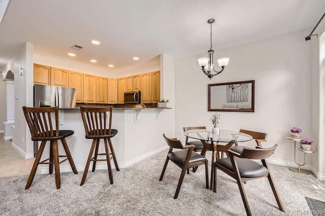 dining area featuring an inviting chandelier, light colored carpet, baseboards, visible vents, and recessed lighting