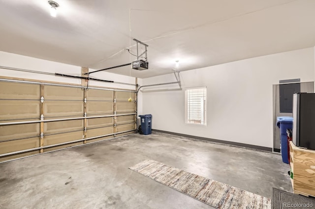 garage with electric panel, baseboards, and a garage door opener