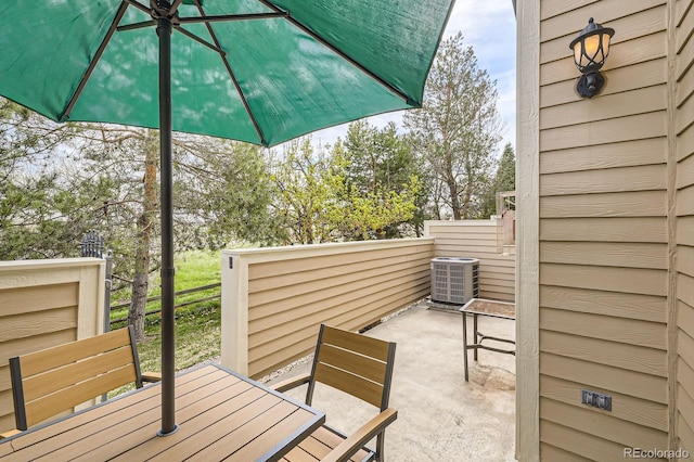 view of patio / terrace featuring central air condition unit and outdoor dining space
