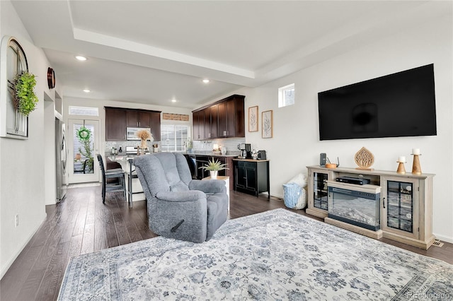 240 S Oak Hill St, Aurora, CO 80018 - living room featuring plenty of natural light, recessed lighting, baseboards, and dark wood-style floors