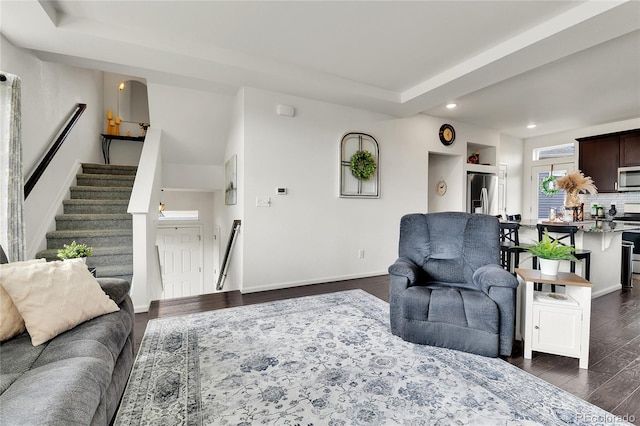 240 S Oak Hill St, Aurora, CO 80018 - living area with recessed lighting, dark wood-type flooring, stairway, and baseboards
