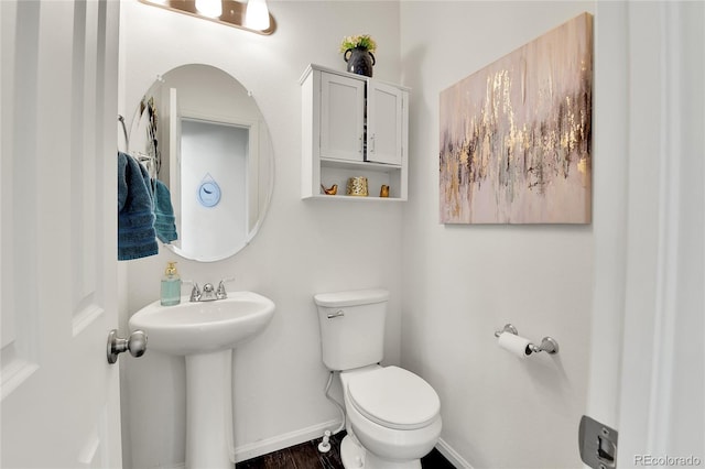 240 S Oak Hill St, Aurora, CO 80018 - bathroom with toilet, baseboards, a sink, and wood finished floors