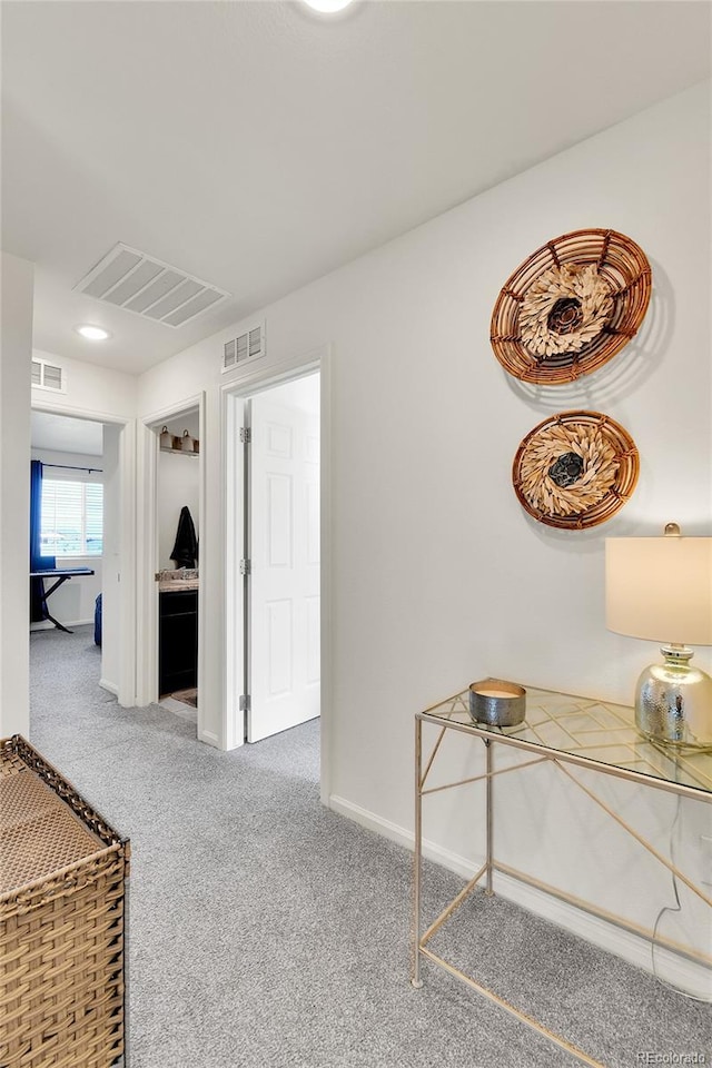 240 S Oak Hill St, Aurora, CO 80018 - hallway featuring carpet and baseboards