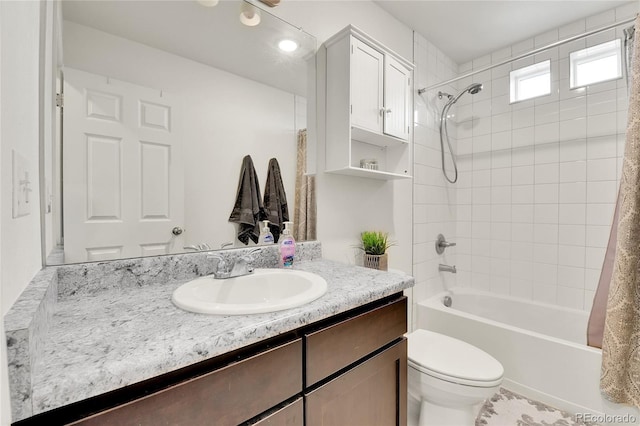 240 S Oak Hill St, Aurora, CO 80018 - full bathroom featuring vanity, shower / tub combo with curtain, and toilet