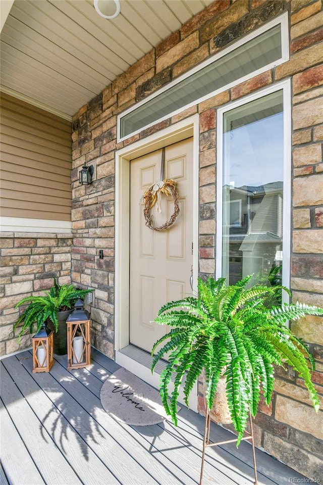 240 S Oak Hill St, Aurora, CO 80018 - entrance to property featuring a porch and stone siding