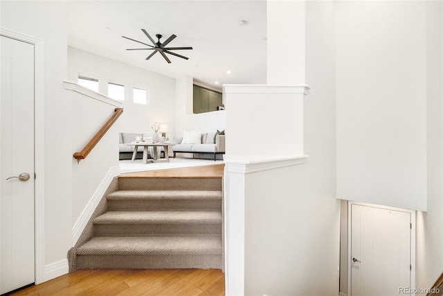 stairway featuring wood finished floors