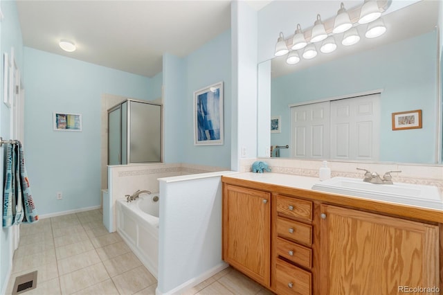 bathroom featuring a garden tub, double vanity, visible vents, a sink, and a shower stall