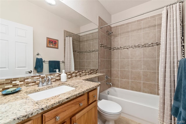 full bathroom featuring tasteful backsplash, shower / bath combo, vanity, and toilet