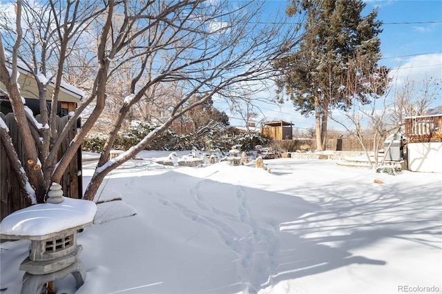 view of yard layered in snow