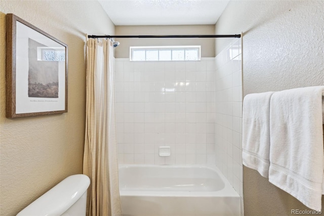 bathroom with toilet and shower / bath combo