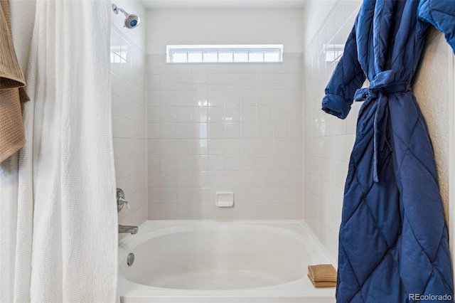 bathroom featuring shower / tub combo with curtain