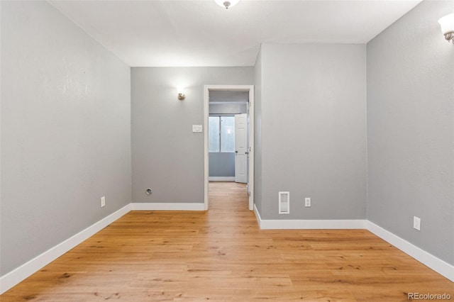 spare room with light wood-type flooring