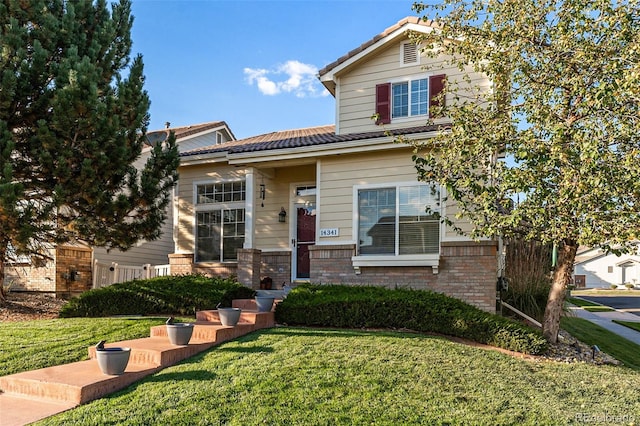 view of front of home featuring a front yard