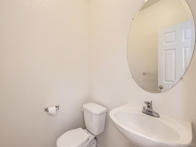 bathroom with sink and toilet