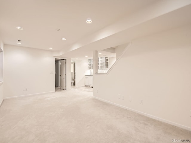 basement with light colored carpet