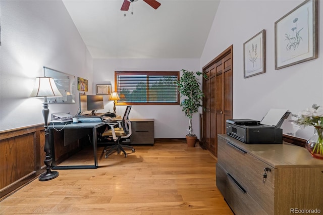 office space with lofted ceiling, light wood-style flooring, and a ceiling fan