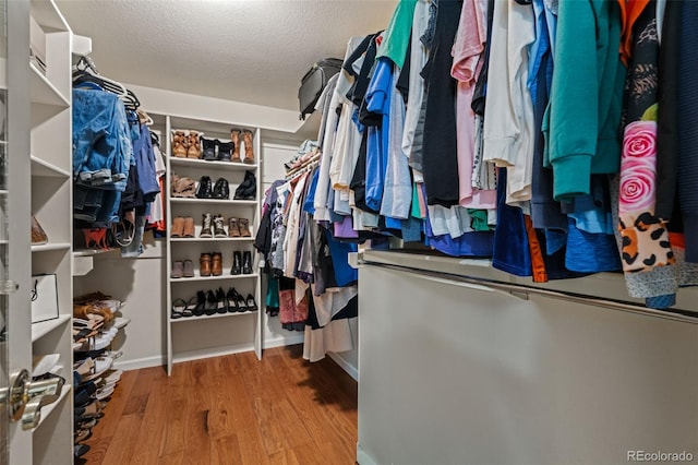 spacious closet with wood finished floors